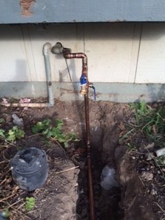 New copper water service line entering a home